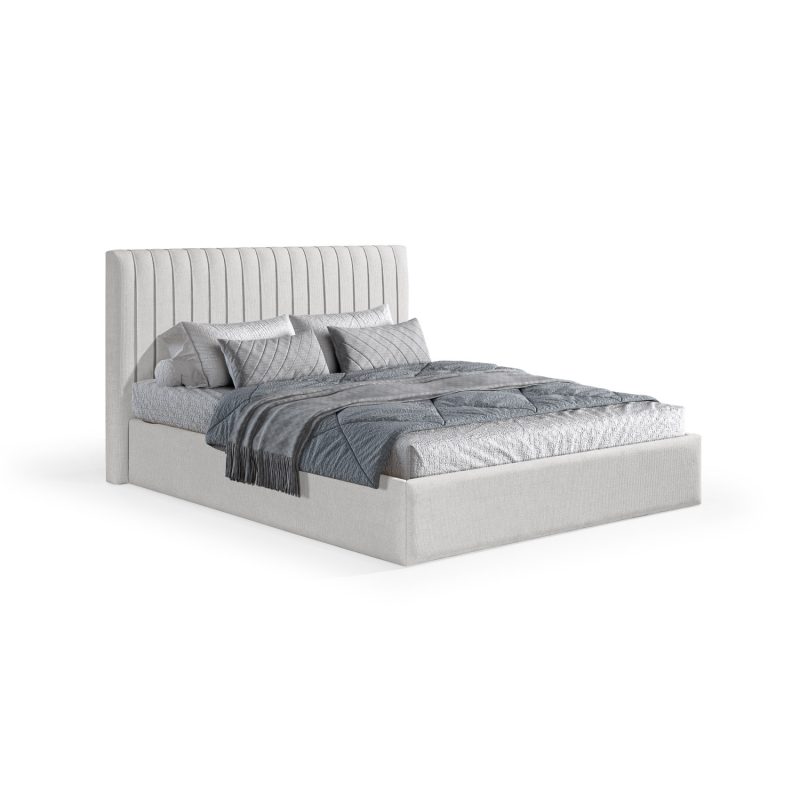 Cama moderna e estofada em cinza, com uma cabeceira alta de costura vertical, decorada com roupa de cama cinzenta, incluindo edredão acolchoado, manta e almofadas, em tons elegantes e contemporâneos.