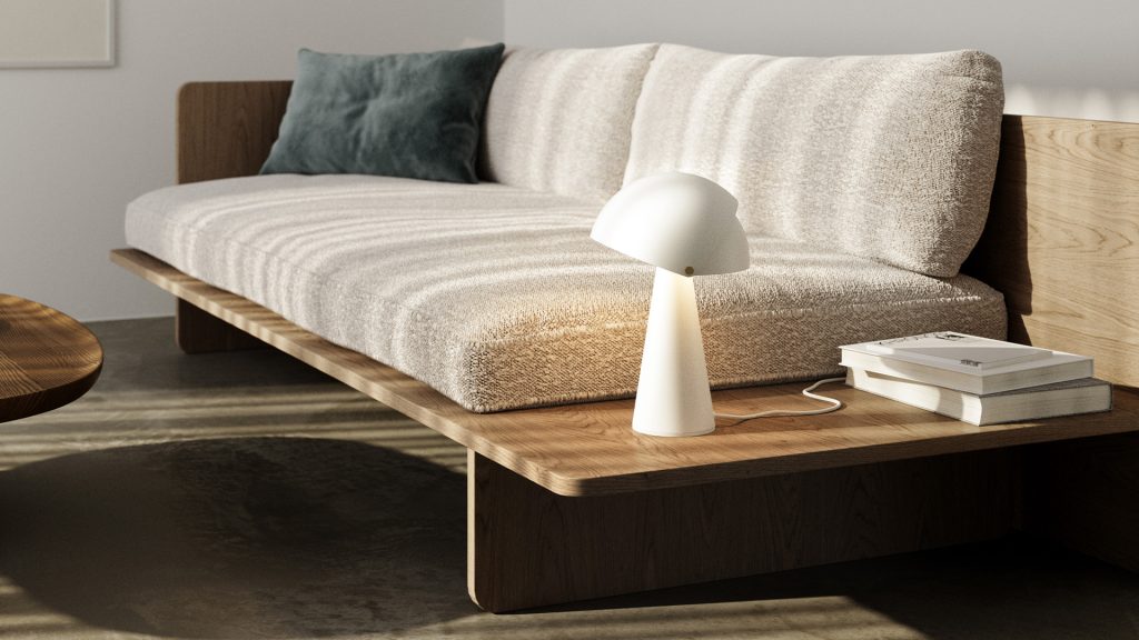 Candeeiro de Mesa branco junto a um sofá e a livros numa sala de estar